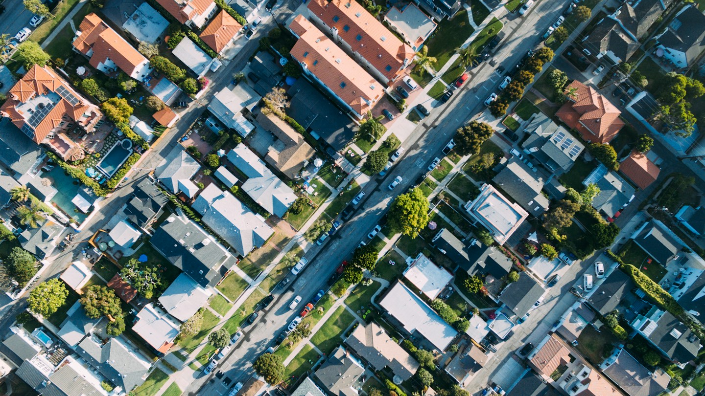 Aerial view of a residential neighborhood served by Slope Masters Roofing in Rockwall, TX