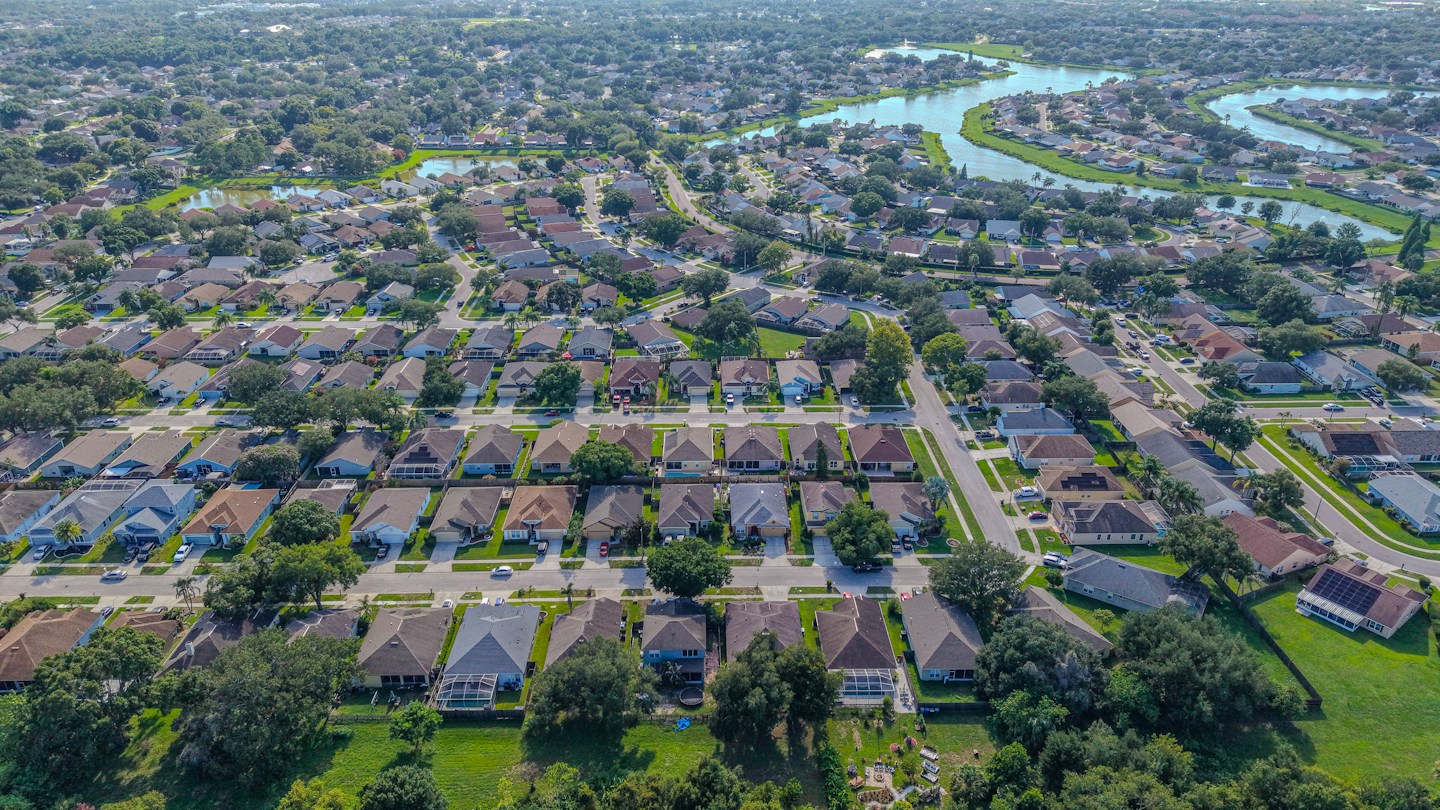 Aerial view of a residential neighborhood served by Slope Masters Roofing in Frisco, TX