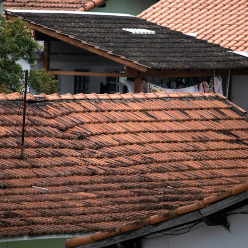 Storm damage assessment, hail impact visible on shingles