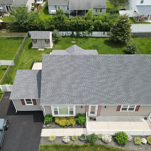 Roof replacement, grey architectural shingles on a suburban DFW home