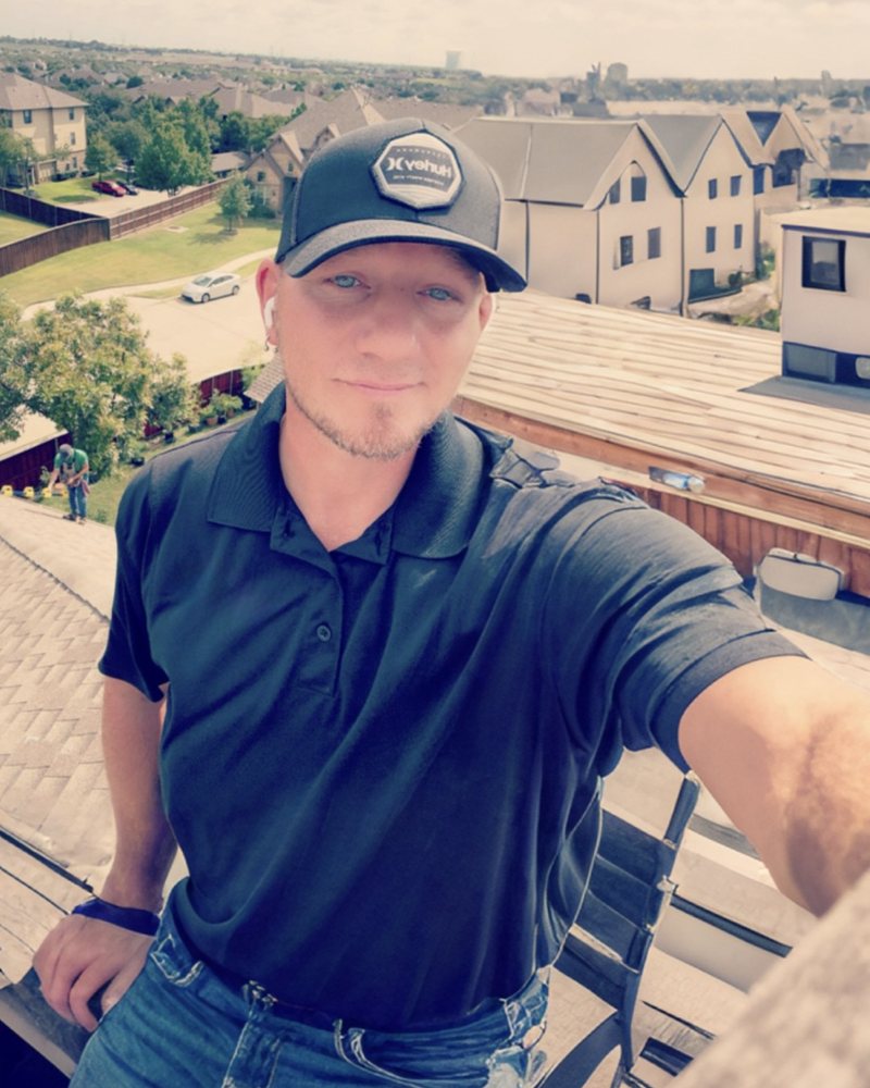 Jason Alamo, President of Slope Masters Roofing, on a North Texas roof